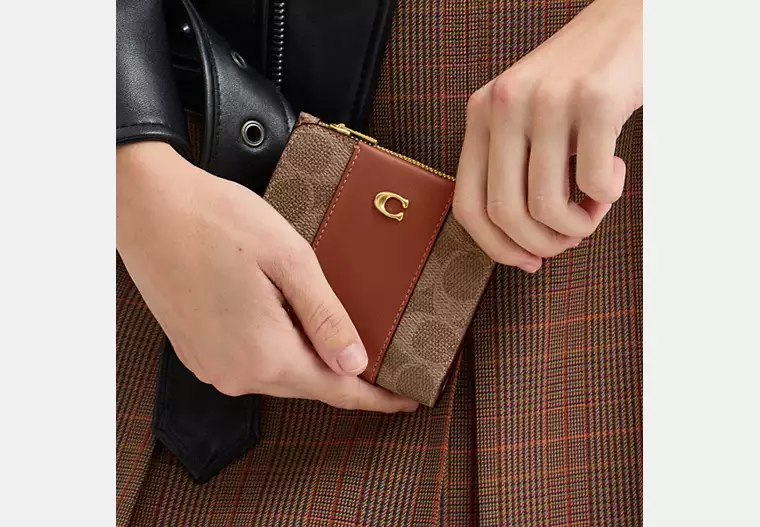 Carteira Coach slim billfold signature