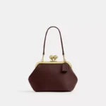 Bolsa Coach Kisslock Frame 16 marrom